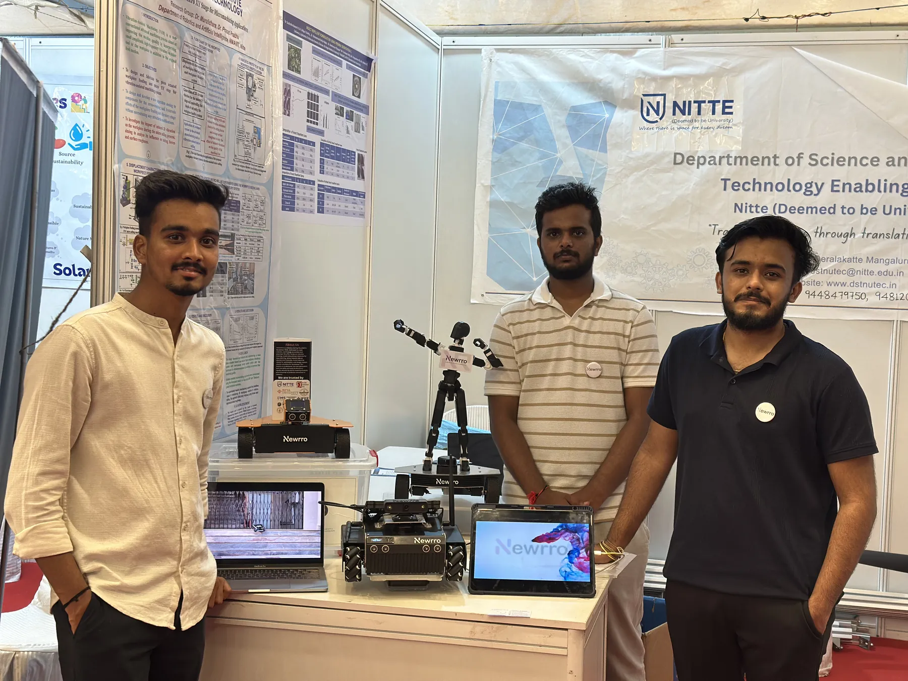 Three members of the Newrro team at their exhibition stand